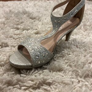 Silver studded kitty heel.
